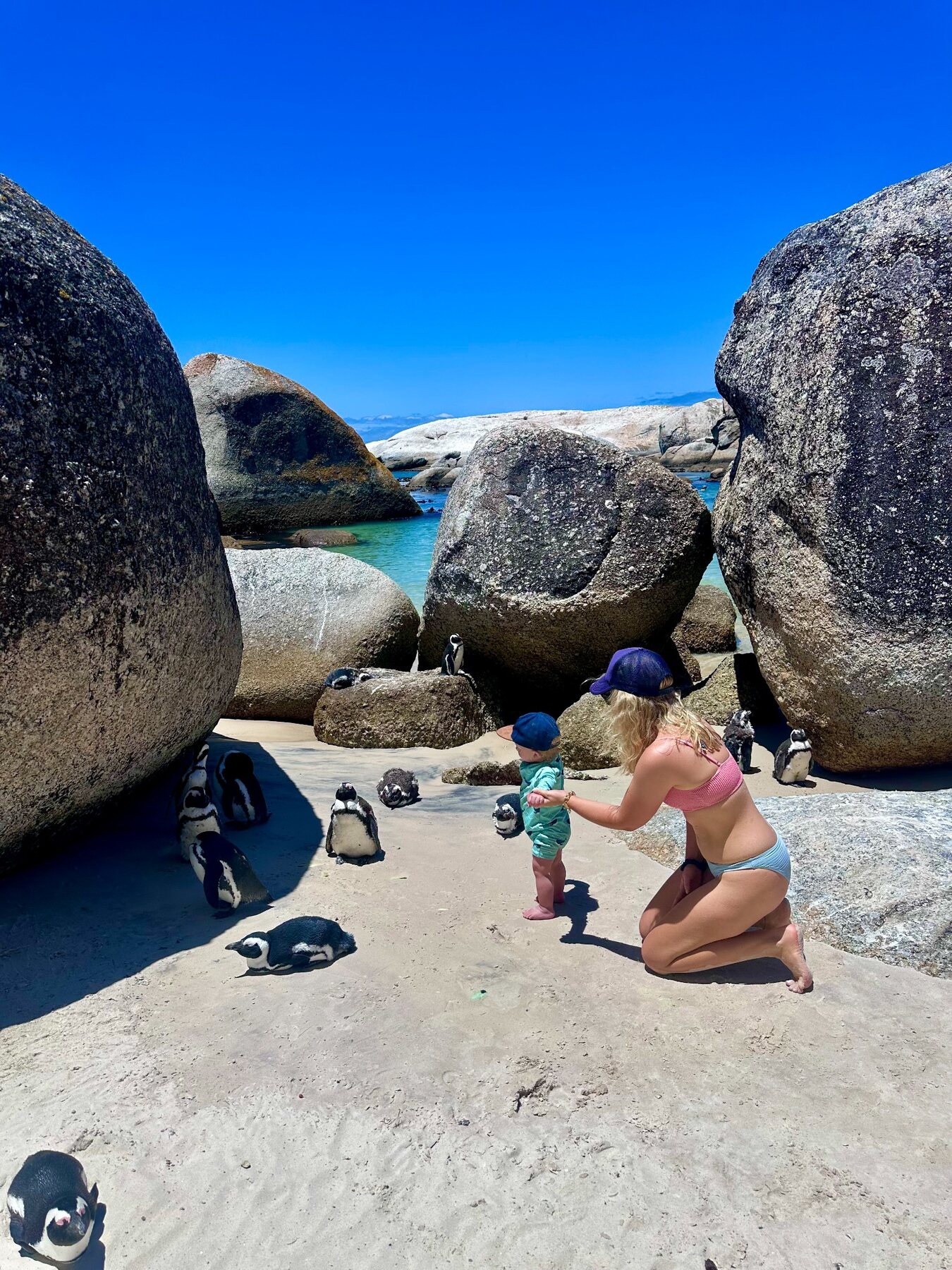 A candid family moment at the beach, photographed from the side